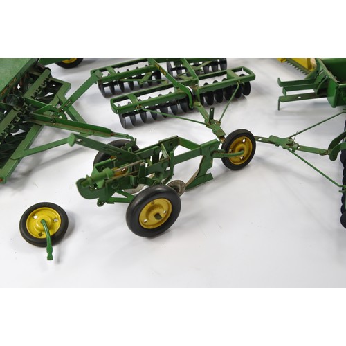 259 - An interesting assortment of ESKA (Pre-Ertl) John Deere Vintage Tractor and Implement issues includi... 