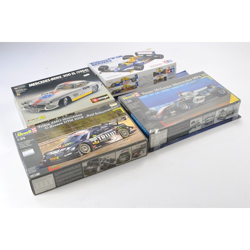 654 - A group of 4 Model Kits comprising various makers including Tamiya Williams F1, Revell and Burago. A... 