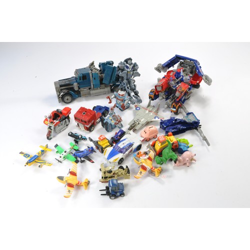 655 - A group of used transformer toys in addition to various tv related figures including Toy Story etc.