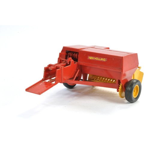 111 - Bourbon (France) large-scale approx 1/16 plastic New Holland Baler. Fragile model is complete with n... 