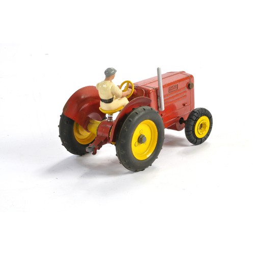 142 - Solido Vintage Mechanical Tractor in red, with driver. In good working order. Generally good with so... 