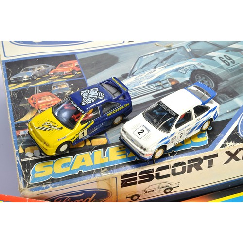 165 - A trio of Scalextric Sets (look to be mostly complete) including Escort XR3i Racing Set.