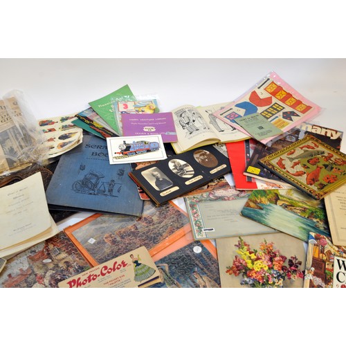 215 - A large collective group of paraphernalia, ephemera and vintage bygones. Puzzles, manuals, royal int... 