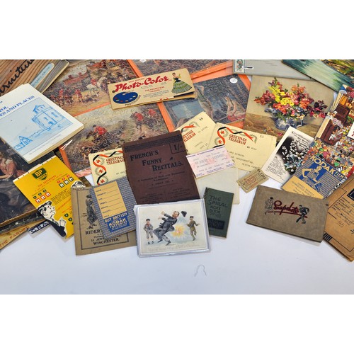 215 - A large collective group of paraphernalia, ephemera and vintage bygones. Puzzles, manuals, royal int... 