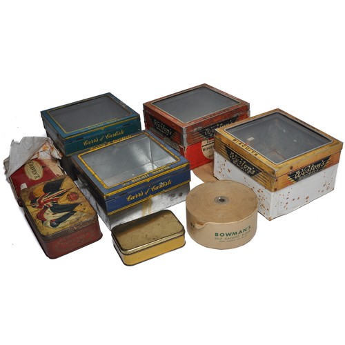 348 - An assortment of vintage tins including shop dispensing biscuit tins with glass lids.