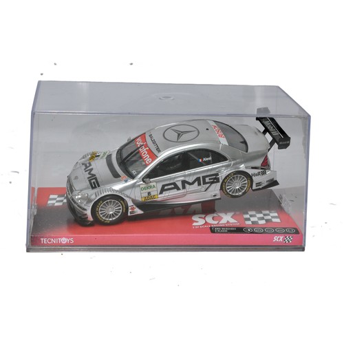 128 - Slot Cars, comprising SCX AMG Mercedes C Class. Looks to be excellent and as-new, in original box.