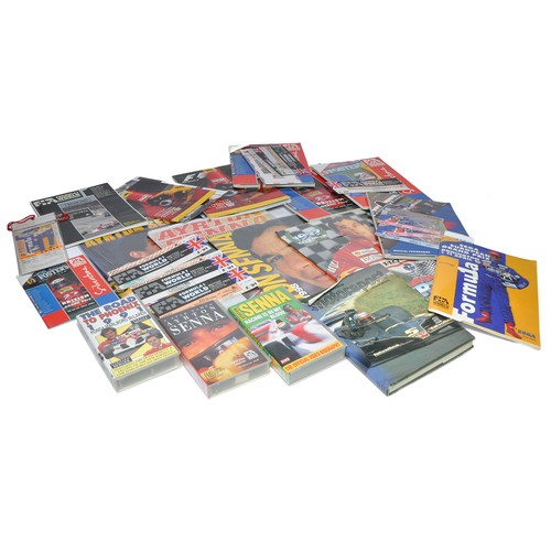 104 - A collection of Formula One Memorabilia to include various race-day programmes including entry ticke... 