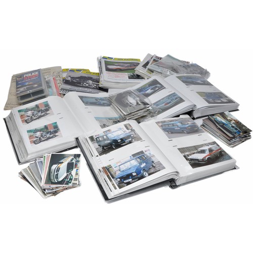 231 - Police car / vehicle collectables comprising a group of three large albums containing Police Vehicle... 