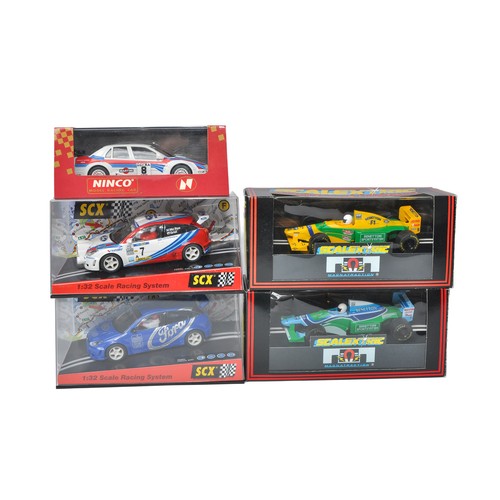 251 - A group of Scalextric, Ninco and SCX Slot cars. All excellent in boxes.