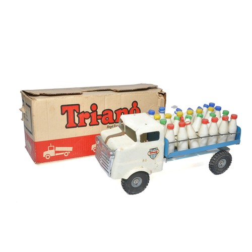 281 - Triang Vintage Pressed Metal Mill Lorry with complete bottle load. Generally very good with only rel... 