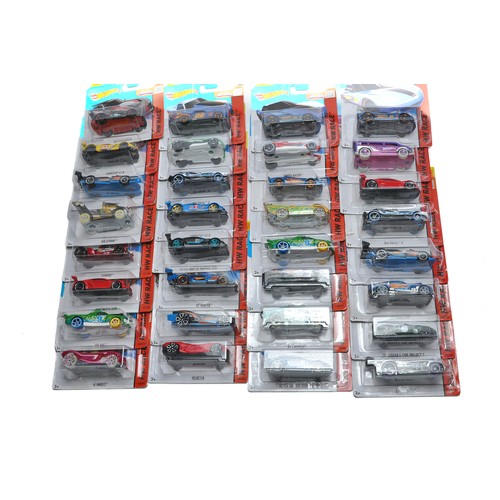 397 - A group of 32 carded Mattel Hot Wheels diecast issues including mostly Race (Track Stars) Series.