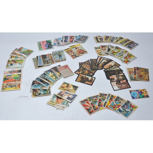 430 - A collection of vintage trading cards featuring issues for Superman, Batman, Captain Scarlet, Thunde... 