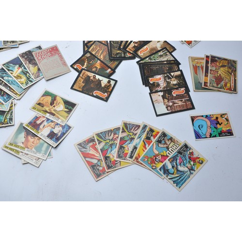 430 - A collection of vintage trading cards featuring issues for Superman, Batman, Captain Scarlet, Thunde... 