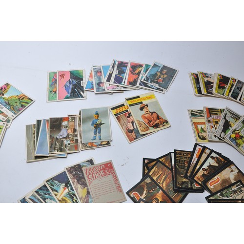 430 - A collection of vintage trading cards featuring issues for Superman, Batman, Captain Scarlet, Thunde... 