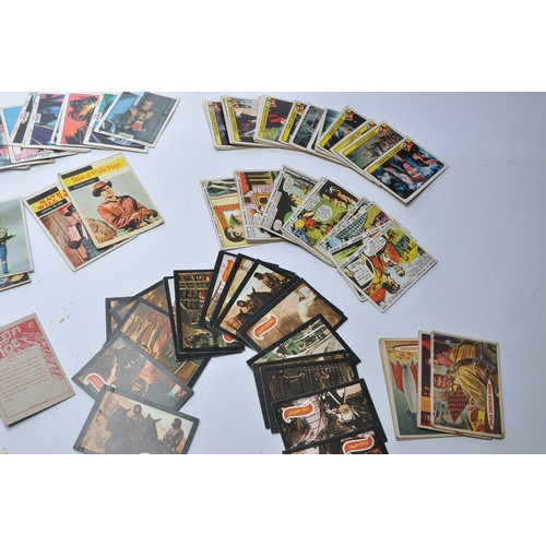 430 - A collection of vintage trading cards featuring issues for Superman, Batman, Captain Scarlet, Thunde... 