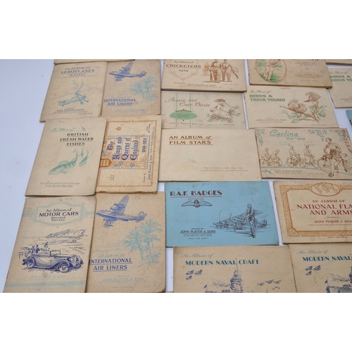 432 - A large collection of vintage John Player Cigarette Cards contained within 43 themed albums to inclu... 