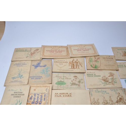 432 - A large collection of vintage John Player Cigarette Cards contained within 43 themed albums to inclu... 