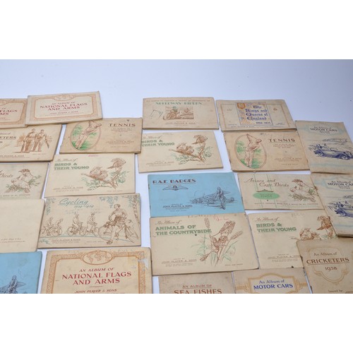 432 - A large collection of vintage John Player Cigarette Cards contained within 43 themed albums to inclu... 