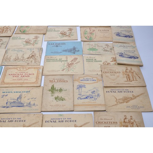 432 - A large collection of vintage John Player Cigarette Cards contained within 43 themed albums to inclu... 