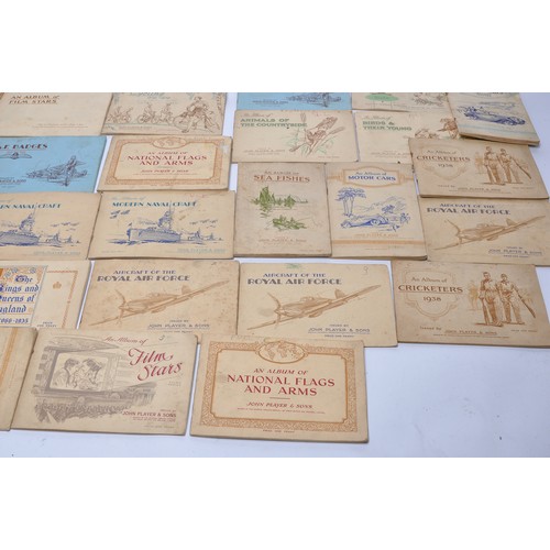 432 - A large collection of vintage John Player Cigarette Cards contained within 43 themed albums to inclu... 