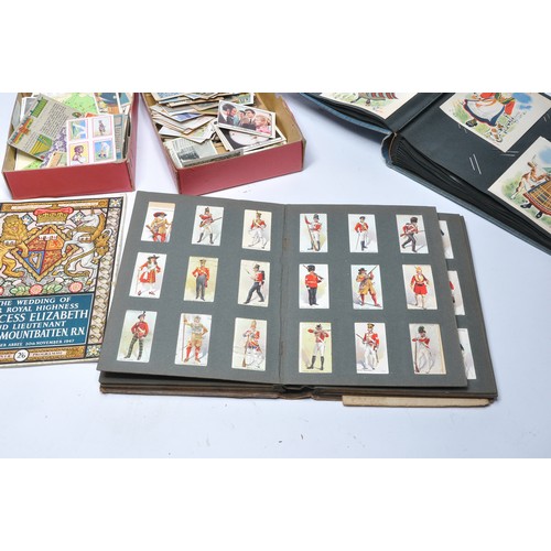 436 - Further Vintage cigarette cards to include an album containing pre-1930 issues including Dickens Cha... 