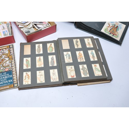 436 - Further Vintage cigarette cards to include an album containing pre-1930 issues including Dickens Cha... 