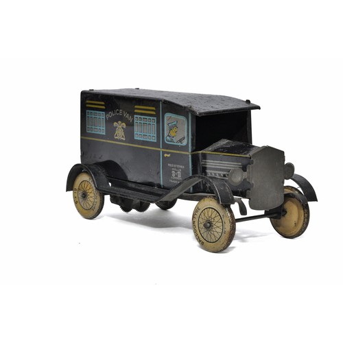 1132 - Wells clockwork tinplate Police Van. Dark blue with litho print. In working order. Generally good bu... 