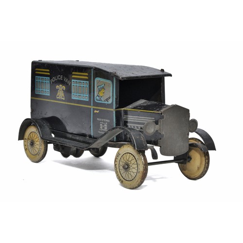 1132 - Wells clockwork tinplate Police Van. Dark blue with litho print. In working order. Generally good bu... 