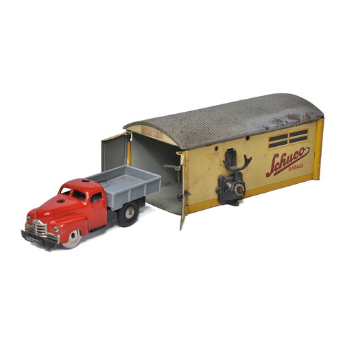 1134 - An original Schuco tinplate mechanical garage (missing telephone handset) plus Varianto dropside tru... 