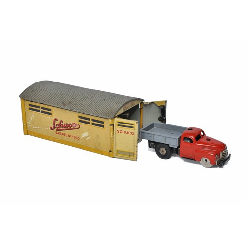 1134 - An original Schuco tinplate mechanical garage (missing telephone handset) plus Varianto dropside tru... 