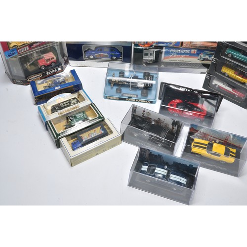 1157 - An assorted group of general diecast models comprising cars and commercials of various themes. To in... 