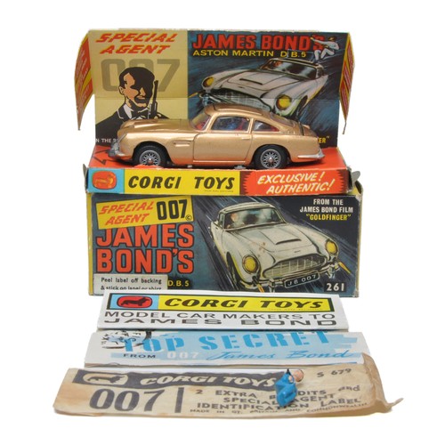 Corgi No. 261 James Bond Aston Martin DB5. Metallic Gold. Complete with leaflets and spare figure. Generally very good, some minor marks and specks of wear in a few places. In very good to excellent box inc inner and outer.
