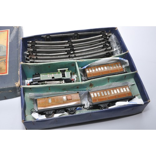 351 - Hornby O Gauge Model Railway issue comprising No. 101 Tank Passenger Set. Displays generally fair to... 