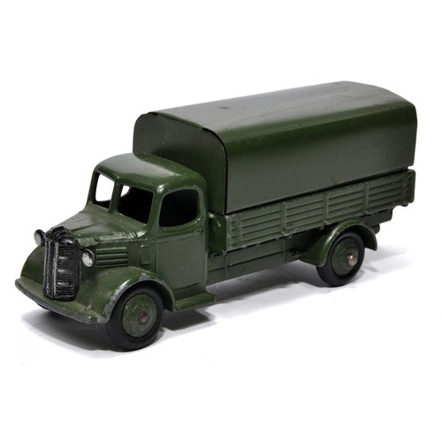 558 - Dinky No. 30SM (Export) Austin Covered Wagon, in military green. Displays good to very good.