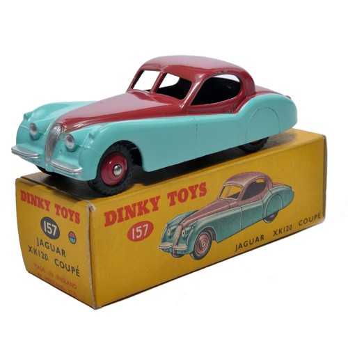 Dinky No. 157 Jaguar XK120 Coupe. Single issue is in two-tone cerise and blue, with red hubs (treaded tyres), as shown. Displays generally excellent, with little sign of wear. In excellent original box, correctly spotted.