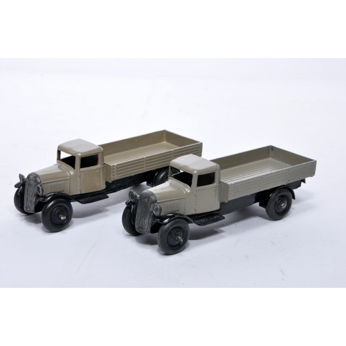 605 - Dinky No. 25a Open back Wagon. Duo of issues in fawn as shown (note baseplate variations). One is ex... 