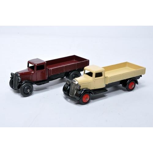 606 - Dinky No. 25a Open back Wagon. Duo of issues in dark maroon and cream (with red hubs) as shown (note... 