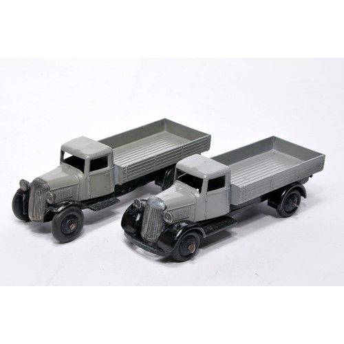 608 - Dinky No. 25a Open back Wagon. Duo of issues in grey as shown (note baseplate variations). Both disp... 