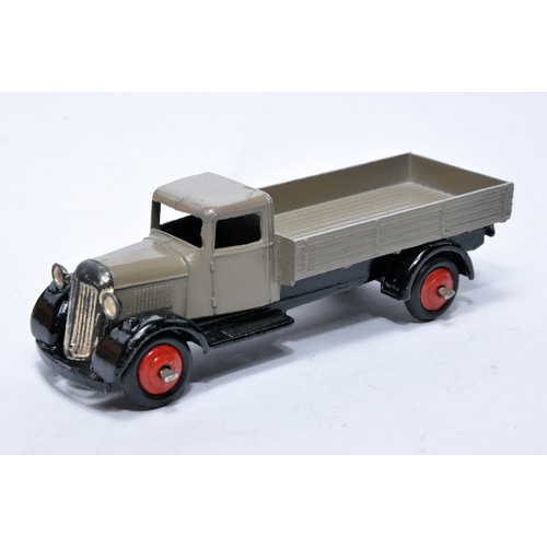 611 - Dinky No. 25a Open back Wagon. Issue is in fawn with red hubs as shown. Generally displays very good... 