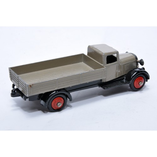 611 - Dinky No. 25a Open back Wagon. Issue is in fawn with red hubs as shown. Generally displays very good... 