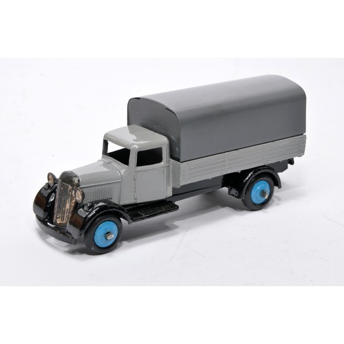 615 - Dinky No. 25b Covered Wagon. Issue is in grey with blue hubs as shown. Generally displays very good ... 