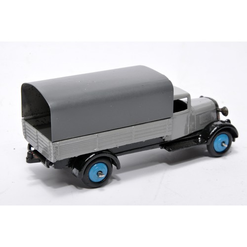 615 - Dinky No. 25b Covered Wagon. Issue is in grey with blue hubs as shown. Generally displays very good ... 