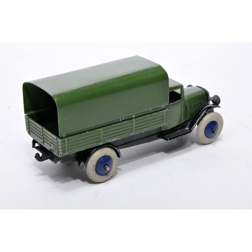 616 - Dinky No. 25b Covered Wagon. Issue is in darker green with blue hubs as shown, open chassis. General... 