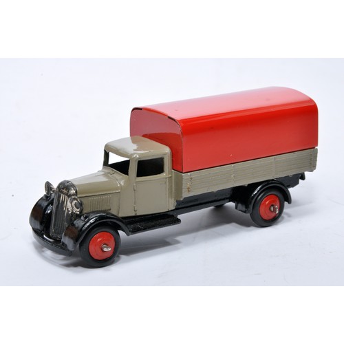 618 - Dinky No. 25b Covered Wagon. Issue is in fawn with red tilt and hubs as shown. Generally displays ve... 
