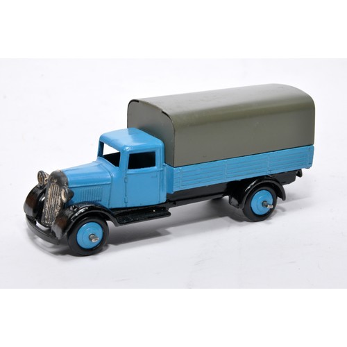 619 - Dinky No. 25b Covered Wagon. Issue is in blue with fawn tilt and blue hubs as shown. Generally displ... 