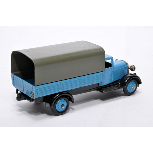 619 - Dinky No. 25b Covered Wagon. Issue is in blue with fawn tilt and blue hubs as shown. Generally displ... 