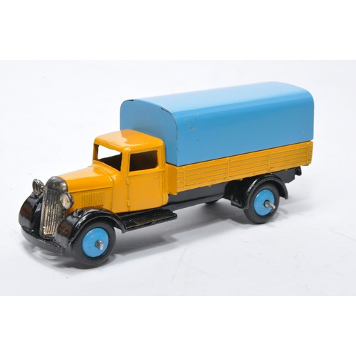 620 - Dinky No. 25b Covered Wagon. Issue is in yellow with blue tilt and hubs as shown. Generally displays... 