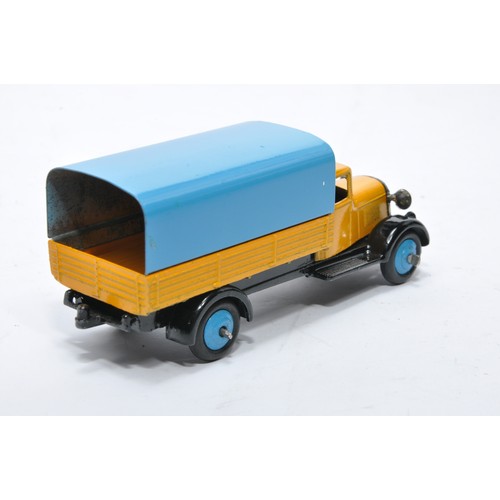 620 - Dinky No. 25b Covered Wagon. Issue is in yellow with blue tilt and hubs as shown. Generally displays... 