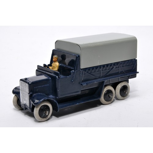 658 - Dinky No. 25s six wheeled covered wagon. Issue is in dark blue, as shown. Displays generally good to... 