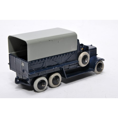 658 - Dinky No. 25s six wheeled covered wagon. Issue is in dark blue, as shown. Displays generally good to... 